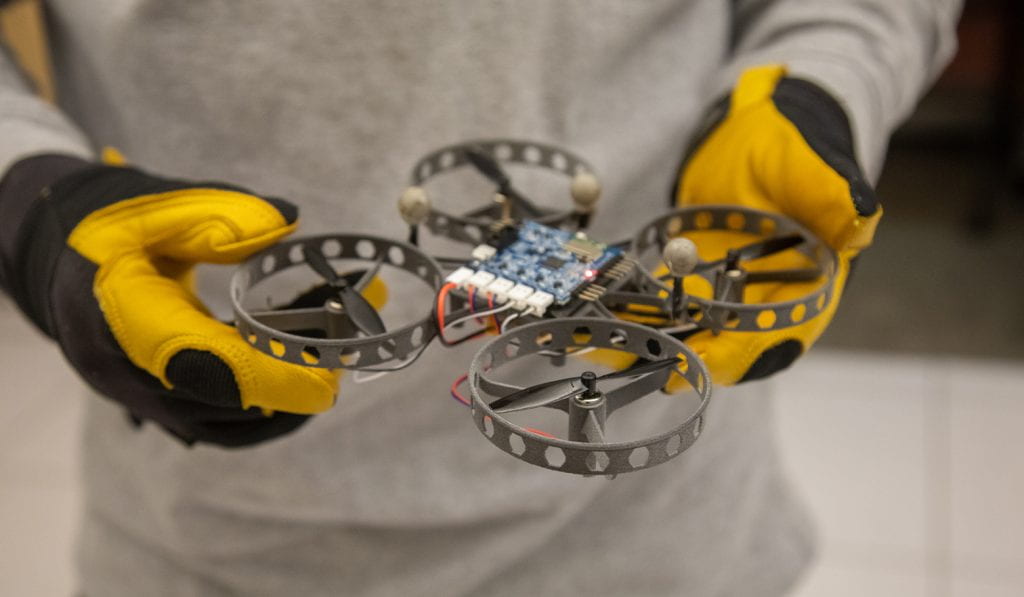Hands holding homemade drone