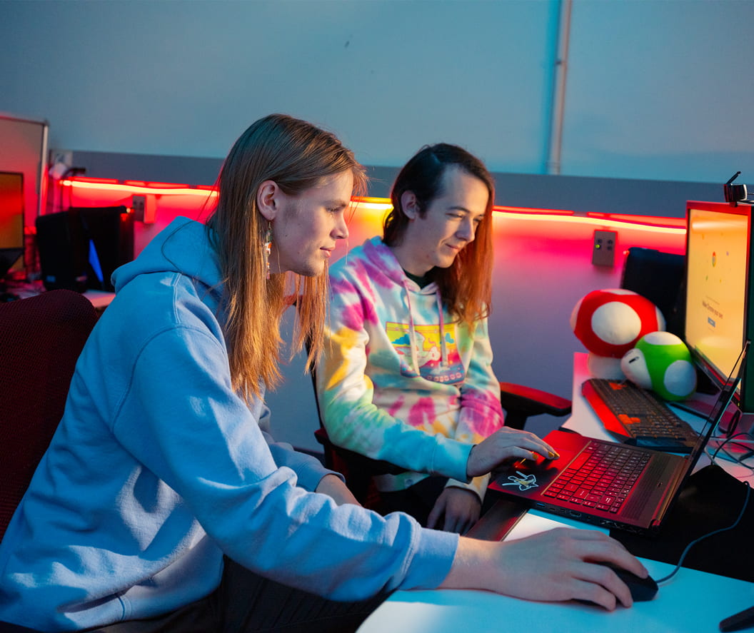 Two students gaming in lab