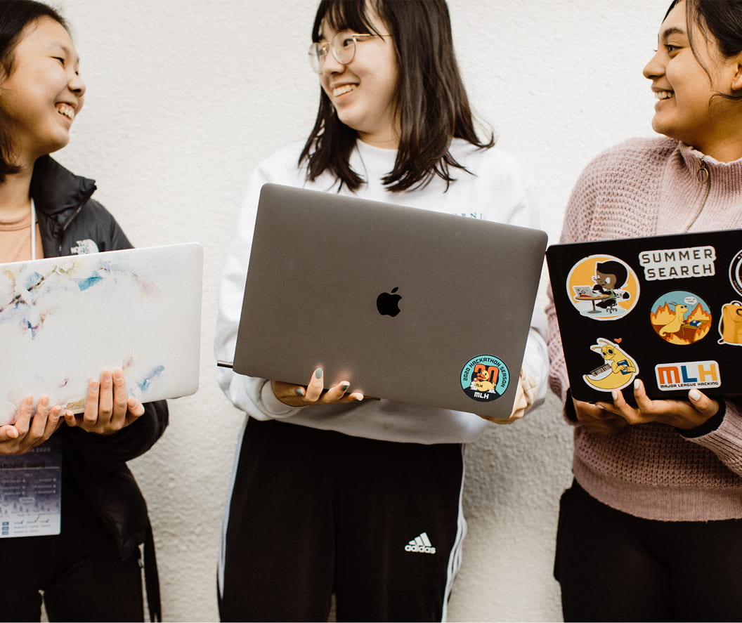 Three students with laptops