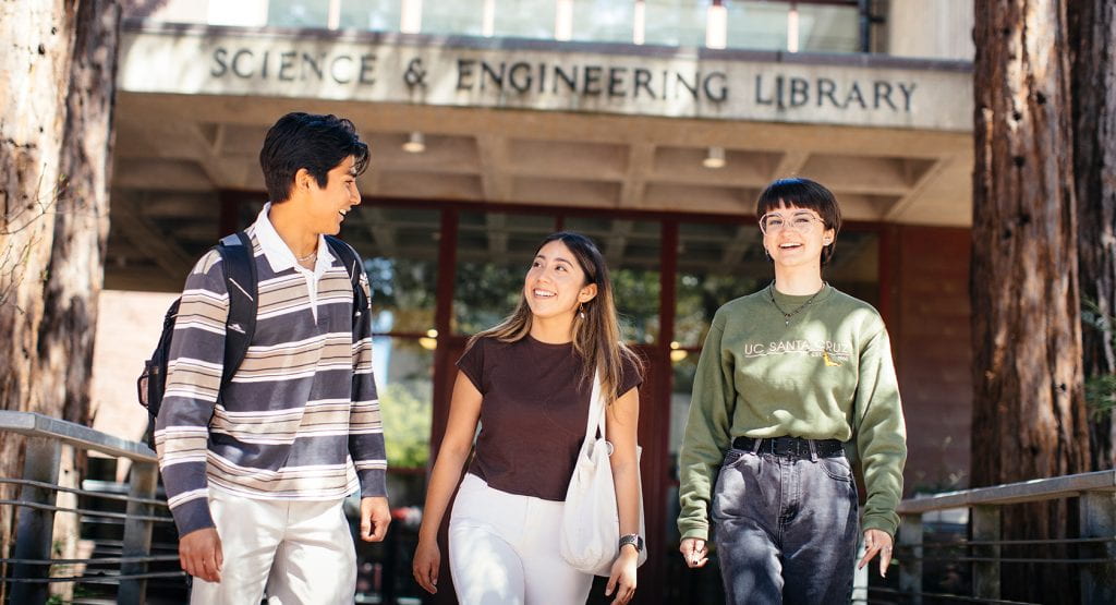  Three students walking outside the Science and Engineering Library